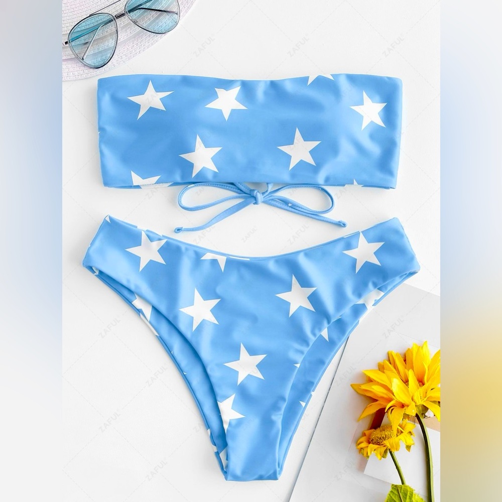 blue Bikini with white stars and In size medium never worn !!